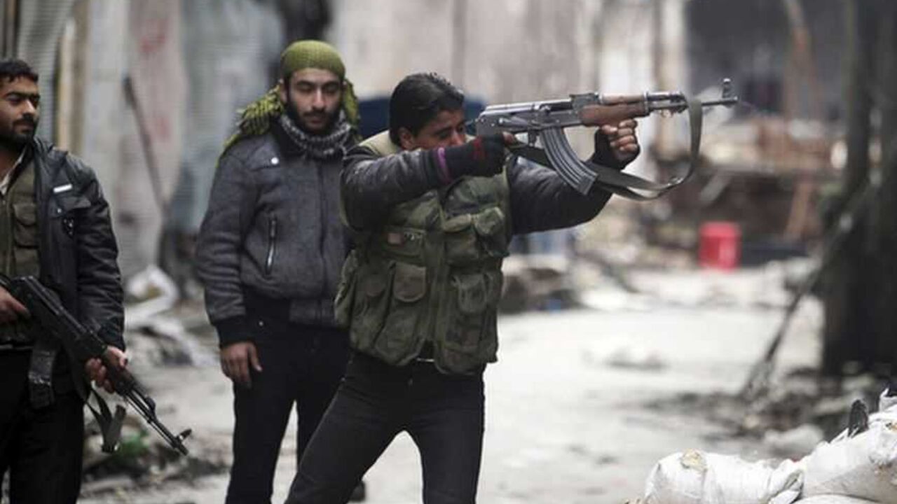A Free Syrian Army fighter fires his weapon towards positions occupied by forces loyal to Syria's President Assad in the old city of Aleppo A Free Syrian Army fighter fires his weapon towards positions occupied by forces loyal to Syria's President Bashar al-Assad in the old city of Aleppo January 7, 2013. REUTERS/Muzaffar Salman (SYRIA - Tags: CONFLICT POLITICS CIVIL UNREST TPX IMAGES OF THE DAY)