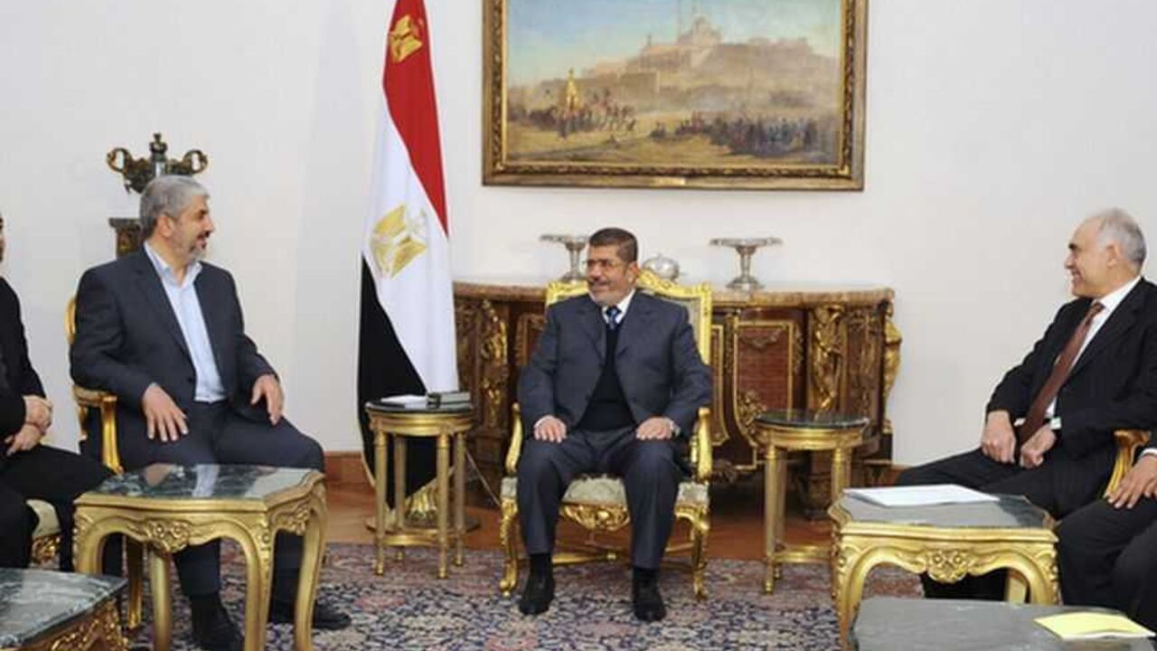 Egyptian President Mohamed Mursi talks with Hamas chief Khaled Meshaal during their meeting in Cairo in this picture provided by the Egyptian Presidency Egyptian President Mohamed Mursi (C) talks with Hamas chief Khaled Meshaal (3rd L) during their meeting in Cairo in this picture provided by the Egyptian Presidency January 9, 2013. REUTERS/Egyptian Presidency/Handout (EGYPT - Tags: POLITICS) ATTENTION EDITORS ? THIS IMAGE WAS PROVIDED BY A THIRD PARTY. FOR EDITORIAL USE ONLY. NOT FOR SALE FOR MARKETING OR ADVERTISING CAMPAIGNS. THIS PICTURE IS DISTRIBUTED EXACTLY AS RECEIVED BY REUTERS, AS A SERVICE TO CLIENTS