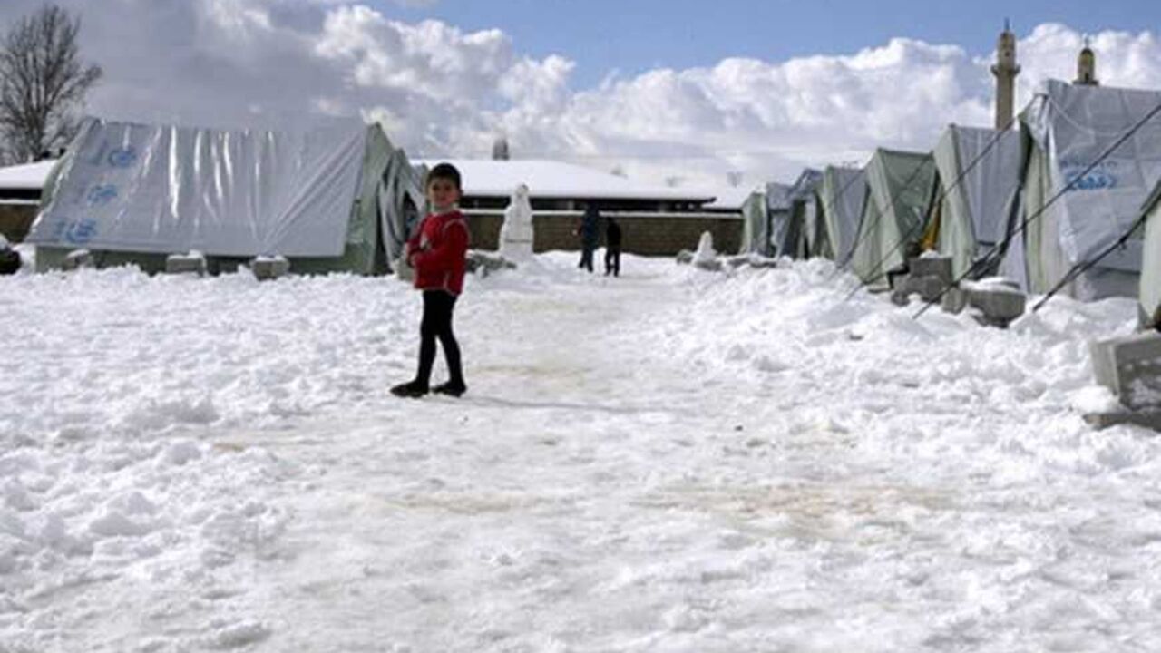 A Syrian child who is also a refugee, plays with snow outside tents in al-Marj, in the Bekaa valley A Syrian child who is also a refugee, plays with snow outside tents in al-Marj, in the Bekaa valley January 10, 2013. REUTERS/Afif Diab (LEBANON - Tags: ENVIRONMENT SOCIETY)