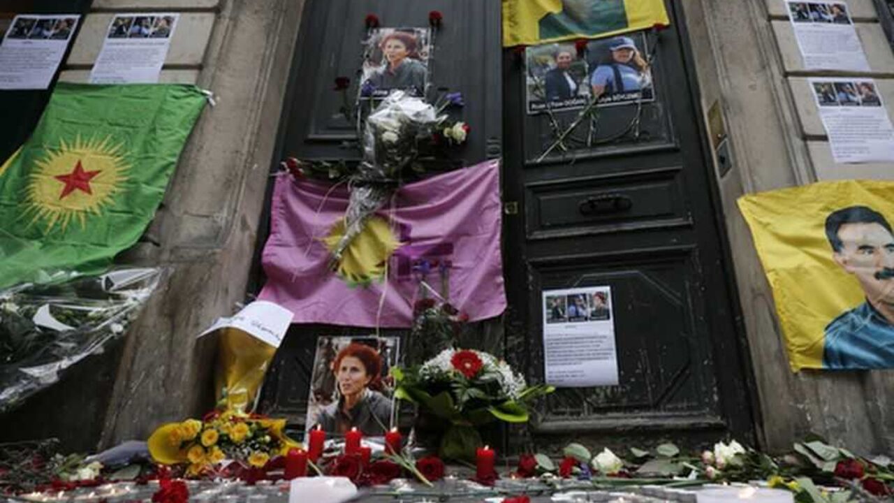Flags flowers and candles displayed by members of the Kurdish community are seen in front of the entrance of the Information Centre of Kurdistan in Paris Flags, flowers and candles displayed by members of the Kurdish community are seen in front of the entrance of the Information Centre of Kurdistan in Paris, where three Kurdish women were found shot dead, January 11, 2013. Three female Kurdish activists including a founding member of the PKK rebel group were shot dead in Paris, January 10, 2013, in execution-style killings condemned by Turkish politicians trying to broker a peace deal. REUTERS/Christian Hartmann (FRANCE - Tags: POLITICS CRIME LAW)