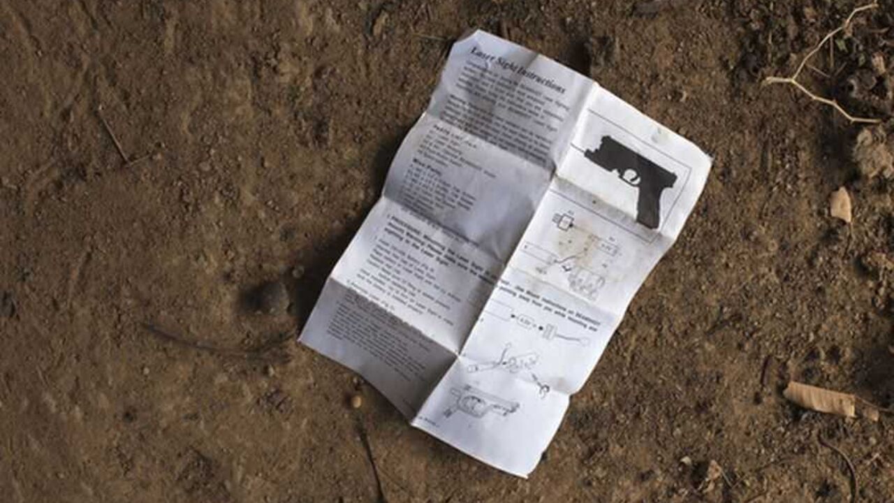 A manual for installing laser sight on gun lies in the courtyard of local resident Issa Dembele's house in Diabaly An English-language manual for installing laser sight on gun, believed to belong to Islamist rebels, lies in the courtyard of local resident Issa Dembele's house in Diabaly January 23, 2013. Dembele said the rebels took over his house when they took control of Diabaly last week to store weapons and munitions. The munitions were later abandoned during fighting between the rebels and the French and Malian militaries. REUTERS/Joe Penney (MALI - Tags: MILITARY CIVIL UNREST POLITICS CONFLICT)