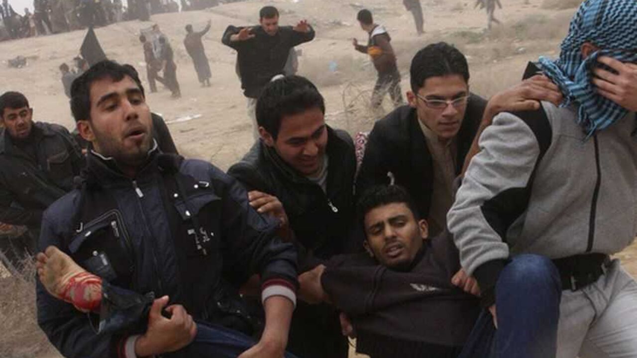 A wounded protester is carried during clashes with security forces in Fallujah A wounded protester is carried during clashes with security forces in Fallujah, 50 km (31 miles) west of Baghdad, January 25, 2013. At least three people were killed on Friday when Iraqi troops opened fire during clashes in Falluja city with Sunni protesters rallying against Shi'ite Prime Minister Nuri al-Maliki, officials and witnesses said. REUTERS/Mohanned Faisal (IRAQ - Tags: POLITICS CIVIL UNREST) - RTR3CXG6