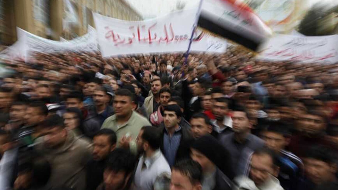 Iraqi Sunni Muslims wave Iraqi national flag during anti-government demonstration at Abu Hanifa Sunni mosque in Adhamiya Iraqi Sunni Muslims wave an Iraqi national flag during an anti-government demonstration at the Abu Hanifa Sunni mosque in Baghdad's Adhamiya district, January 25, 2013. At least three people were killed on Friday when Iraqi troops opened fire during clashes in Falluja city with Sunni protesters rallying against Shi'ite Prime Minister Nuri al-Maliki, officials and witnesses said. REUTERS/Thaier Al-Sudani (IRAQ - Tags: POLITICS CIVIL UNREST RELIGION) - RTR3CXNM