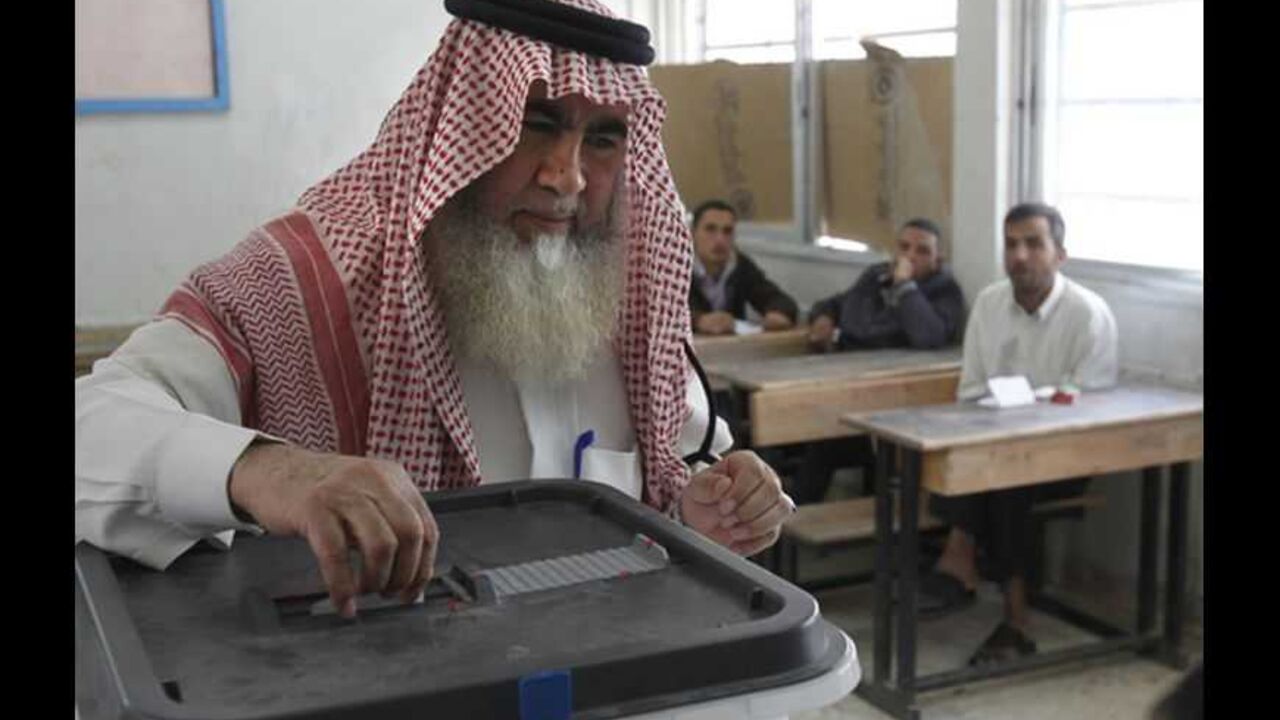 A man casts his ballot at a polling station at Talbia Palestinian refugee camp near Amman A man casts his ballot at a polling station at Talbia Palestinian refugee camp near Amman November 9, 2010. Jordanians voted on Tuesday in parliamentary elections boycotted by the influential Muslim Brotherhood and liberal groups in protest at an election law they say erodes democracy. REUTERS/Ali Jarekji (JORDAN - Tags: POLITICS ELECTIONS) - RTXUEYZ