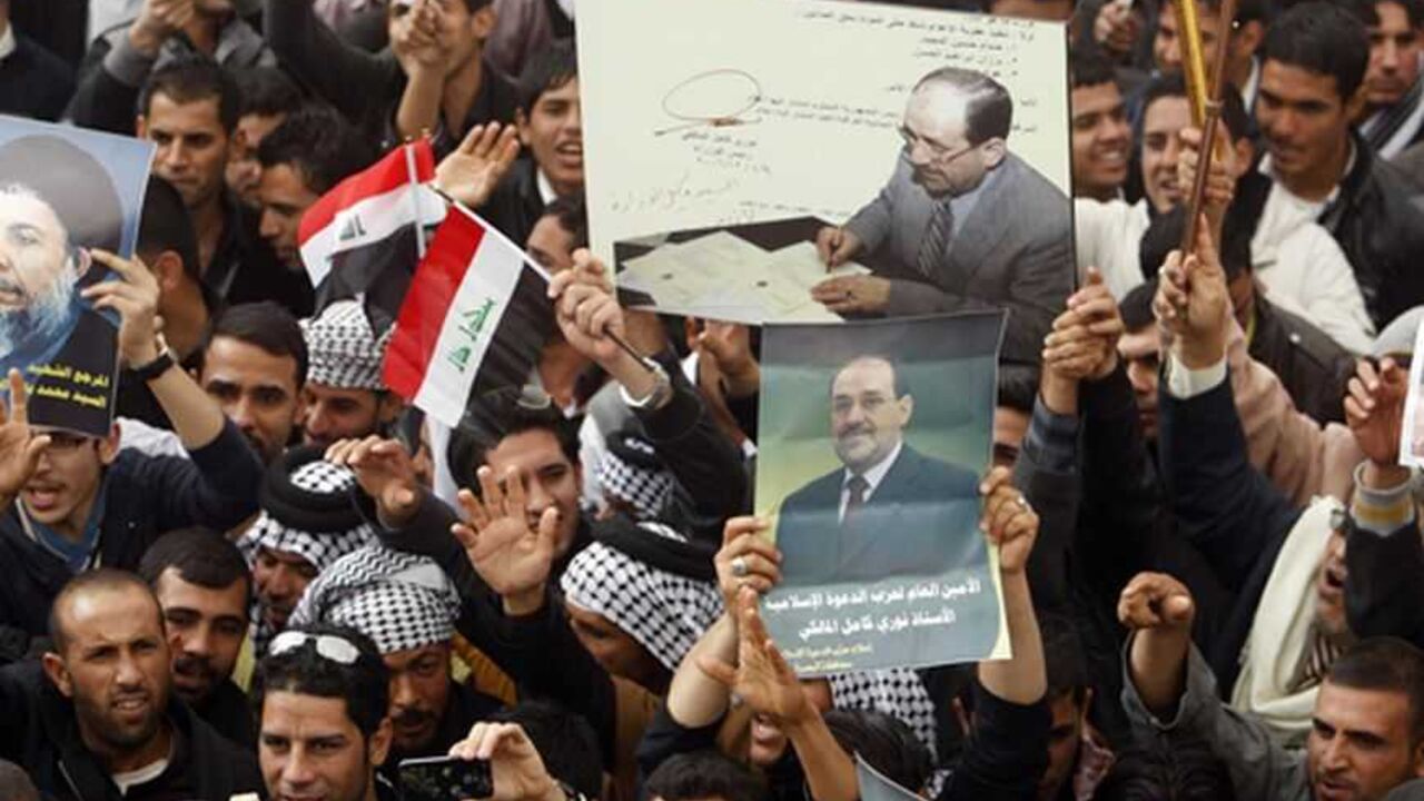 IRAQ/ Supporters of Iraqi Prime Minister Nuri al-Maliki shouts slogans during a demonstration in Basra , 420 km (261 miles) southeast of Baghdad January 8, 2013. REUTERS/Atef Hassan (IRAQ - Tags - Tags: POLITICS CONFLICT)