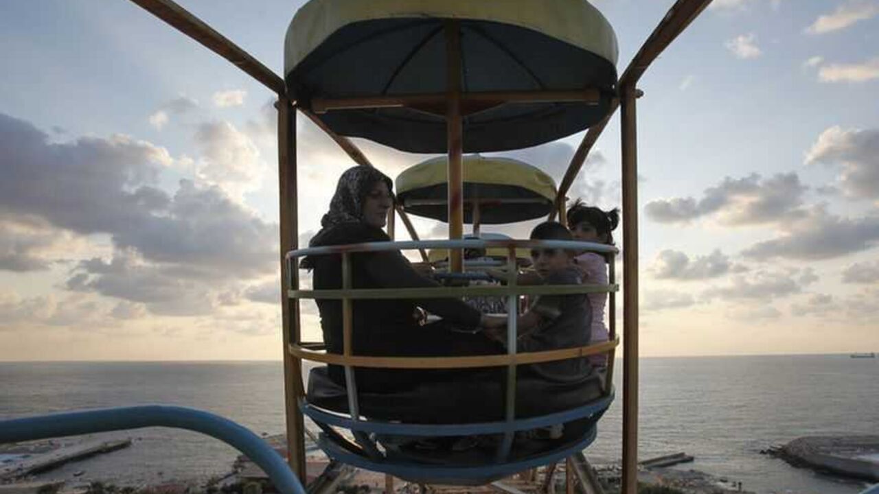A Muslim family enjoy a ride on a ferris wheel at an amusement park during Eid al-Fitr in Beirut A Muslim family enjoy a ride on a ferris wheel at an amusement park during Eid al-Fitr in Beirut August 30, 2011. Muslims around the world celebrate Eid al-Fitr to mark the end of Ramadan, the holiest month in the Islamic calendar. REUTERS/Cynthia Karam (LEBANON - Tags: RELIGION) - RTR2QK5N