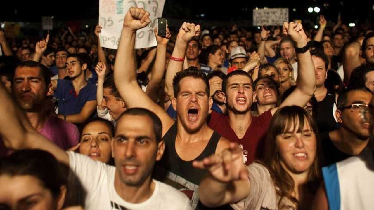 Israelis take part in a demonstration calling for lower living costs and social justice in Tel Aviv Israelis take part in a demonstration calling for lower living costs and social justice in Tel Aviv September 3, 2011. Hundreds of thousands marched on Saturday for lower living costs in the largest such rally in Israel's history, bolstering a social change movement and mounting pressure on Prime Minister Benjamin Netanyahu to take on economic reform. Protest leaders called it "the moment of truth" for the grassroots movement that has swollen since July from a cluster of student tent-squatters into a countr