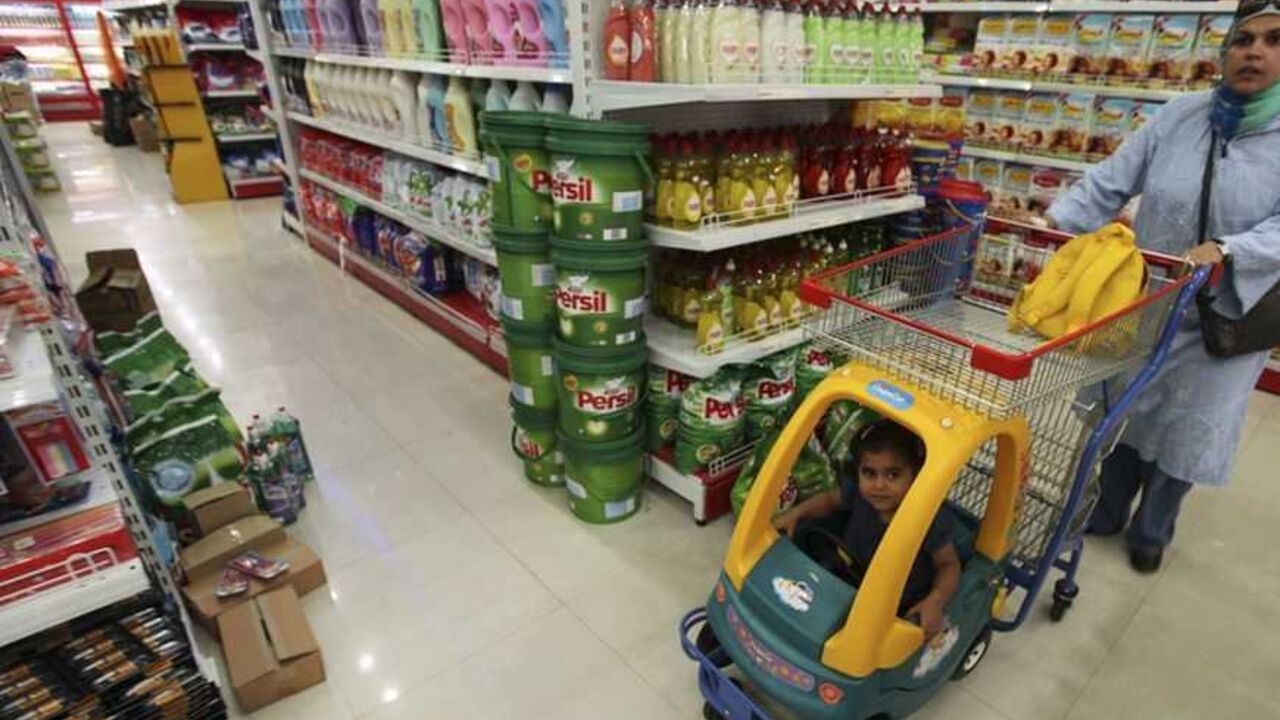 To match Feature PALESTINIANS-GAZA/LUXURY A Palestinian woman and her daughter shop at Metromarket supermarket in Gaza City September 5, 2011. Amidst the poverty and deprivation of the Gaza Strip, a few small signs of prosperity have started to emerge, giving violence-weary locals a taste of comfort that is taken for granted in much the rest of the world. Picture taken September 5, 2011. To match Feature PALESTINIANS-GAZA/LUXURY REUTERS/Mohammed Salem (GAZA - Tags: SOCIETY BUSINESS) - RTR2QXBF