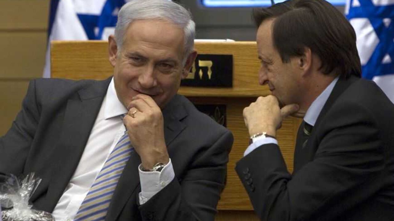 Israel's Prime Minister Benjamin Netanyahu (L) speaks with Deputy Prime Minister Dan Meridor during a Likud party meeting at the Knesset, the Israeli parliament, in Jerusalem September 20, 2011. Netanyahu leaves for New York on Wednesday to address the United Nations where Palestinian President Mahmoud Abbas is pursuing a bid for full U.N. membership for a Palestinian state.    REUTERS/Darren Whiteside (JERUSALEM - Tags: POLITICS) - RTR2RL9O