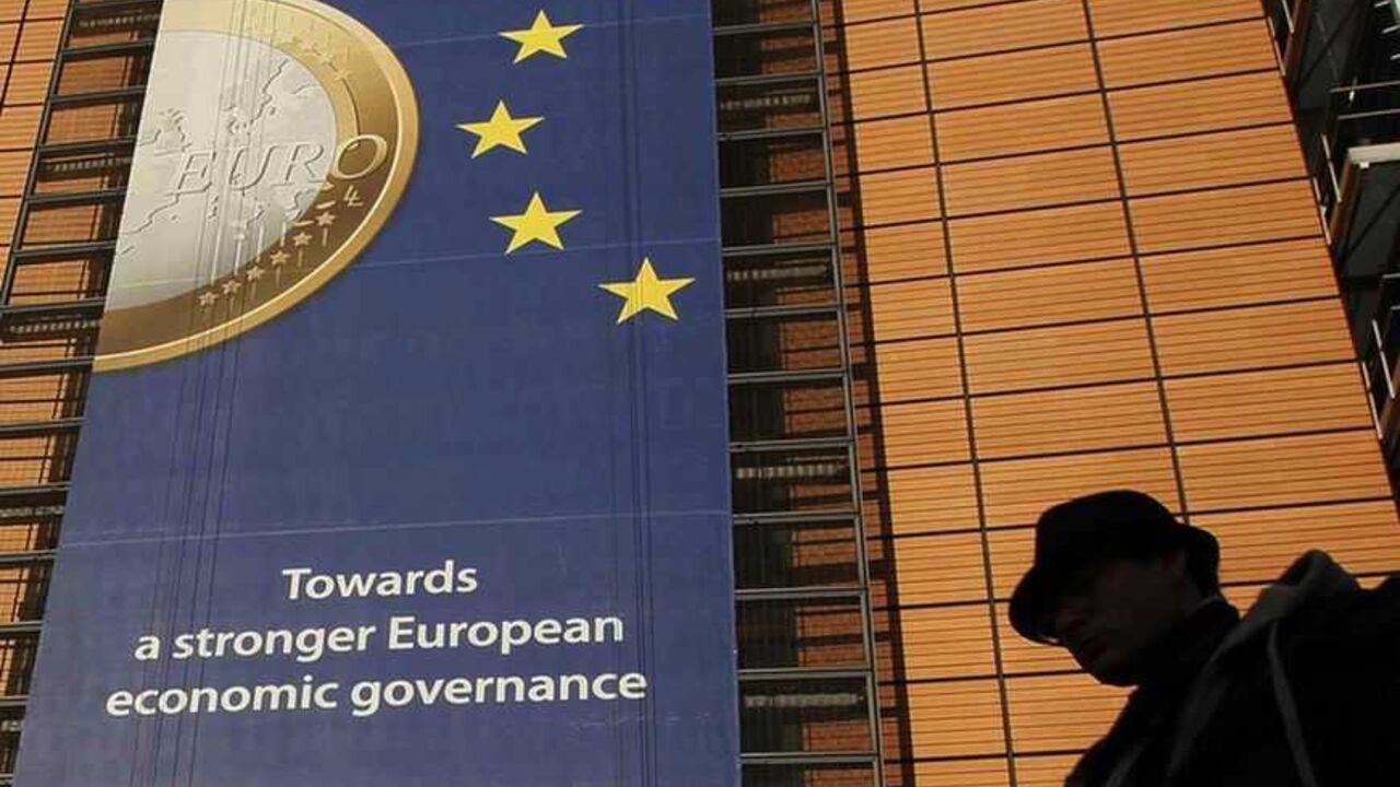 A banner featuring a Euro coin is seen on the European Commission headquarters building in Brussels A banner featuring a Euro coin is seen on the European Commission headquarters building in Brussels December 19, 2011. REUTERS/Yves Herman (BELGIUM - Tags: POLITICS BUSINESS) - RTR2VFYJ
