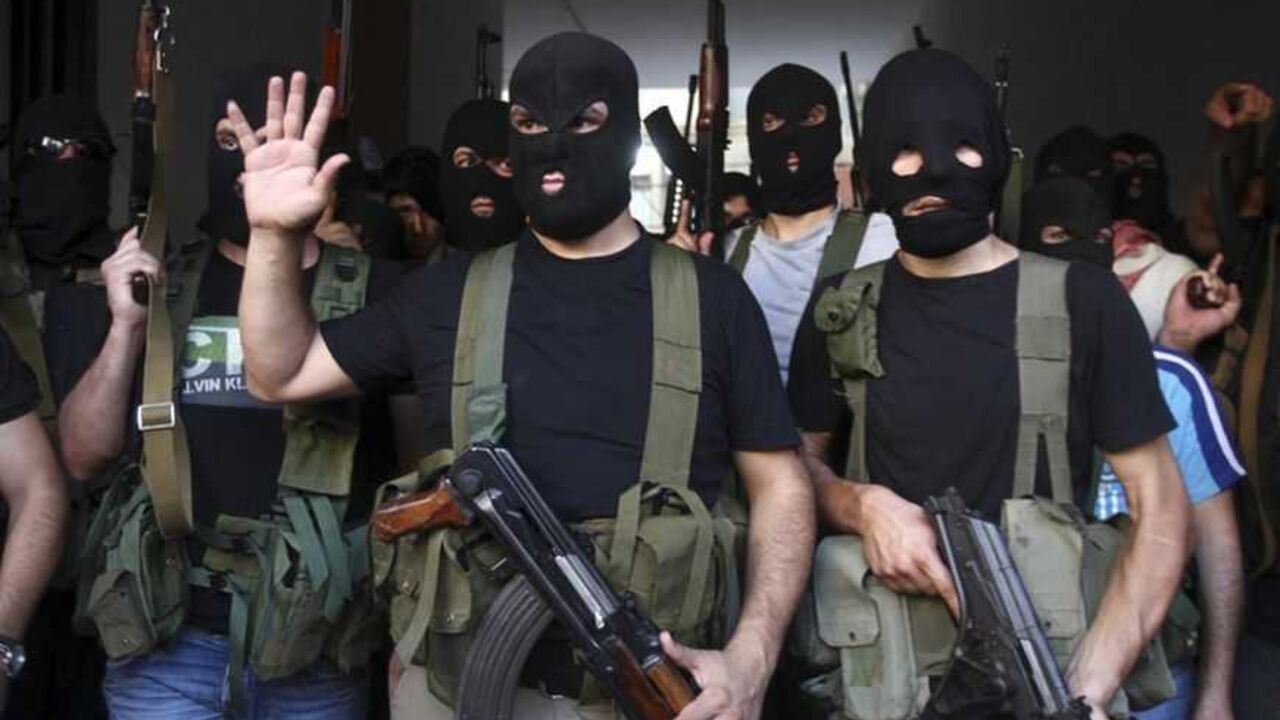 Shi'ite masked gunmen from the Meqdad clan, gather at the Meqdad family's association headquarters in the southern suburbs in Beirut Shi'ite masked gunmen from the Meqdad clan, gather at the Meqdad family's association headquarters in the southern suburbs in Beirut, August 15, 2012. A Shi'ite Muslim clan in Lebanon has abducted a Turkish businessman and several Syrians it says are rebel fighters in retaliation for the kidnapping of one of their relatives by the rebel Free Syrian Army in Damascus. REUTERS/Khalil Hassan (LEBANON - Tags: POLITICS CIVIL UNREST TPX IMAGES OF THE DAY) - RTR36V96