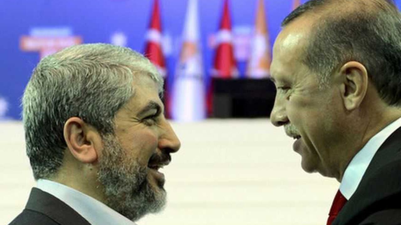 Turkey's Prime Minister and leader of ruling Justice and Development Party Erdogan welcomes his guest Hamas leader Meshaal during the AKP congress in Ankara Turkey's Prime Minister and leader of ruling Justice and Development Party (AKP) Tayyip Erdogan (R) welcomes his guest Hamas leader Khaled Meshaal during the AKP congress in Ankara September 30, 2012. Erdogan trumpeted Turkey's credentials as a rising democratic power on Sunday, saying his Islamist-rooted ruling party had become an example to the Muslim world after a decade in charge. Addressing thousands of party members and regional leaders at a congress of his Justice and Development (AK) Party, Erdogan