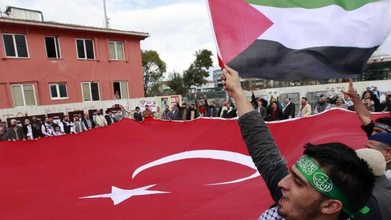 Protesters shout anti-Israel slogans during a protest in front of a court house in Istanbul Protesters shout anti-Israel slogans during a protest in front of a court house in Istanbul November 6, 2012. Hundreds of protesters chanting "Murderer Israel!" gathered outside an Istanbul court on Tuesday at the start of a trial of a group of former Israeli military commanders charged over the 2010 killing of nine Turks aboard a Gaza-bound aid ship. REUTERS/Osman Orsal (TURKEY - Tags: POLITICS CIVIL UNREST CRIME LAW) - RTR3A20Q