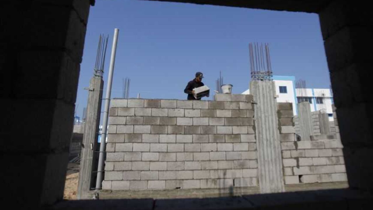 Palestinian labourer works at a construction site in Rafah in the southern Gaza Strip A Palestinian labourer works at a construction site in Rafah in the southern Gaza Strip January 2, 2013. Israel eased its blockade of Gaza on Sunday, allowing a shipment of gravel for private construction into the Palestinian territory for the first time since Hamas seized control in 2007. REUTERS/Ibraheem Abu Mustafa (GAZA - Tags: POLITICS BUSINESS CONSTRUCTION) - RTR3C1PS