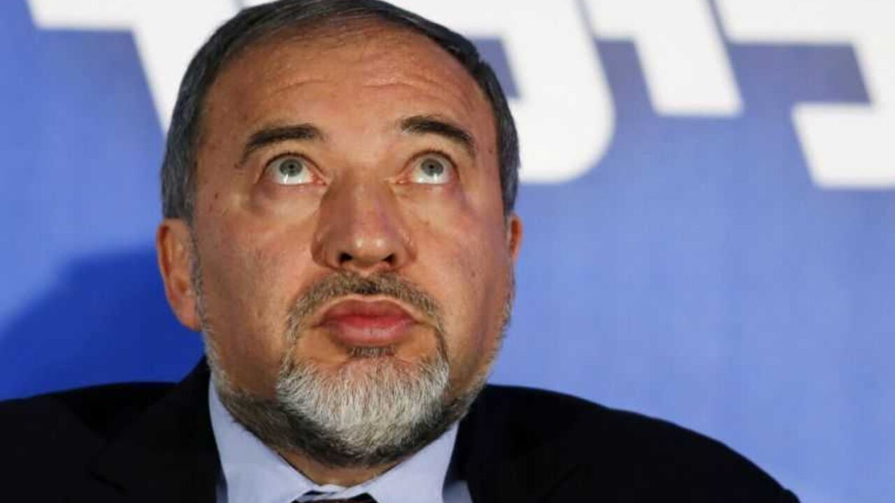 Former Israeli Foreign Minister and head of the Yisrael Beitenu party Lieberman attends a campaign rally in Ashdod Former Israeli Foreign Minister and head of the Yisrael Beitenu party Avigdor Lieberman attends a Likud-Yisrael Beitenu campaign rally in the southern city of Ashdod January 16, 2013. Prime Minister Benjamin Netanyahu's right-wing Likud party, allied with the nationalist Yisrael Beitenu party, continues to lead opinion polls ahead of Israel's Jan. 22 parliamentary election. REUTERS/Amir Cohen (ISRAEL - Tags: POLITICS ELECTIONS) - RTR3CJ8V