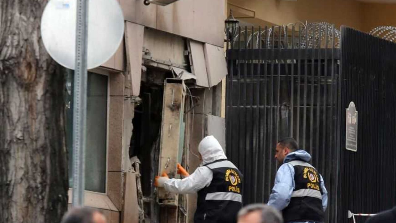 Turkish police bomb experts inspect the site after an explosion at the entrance of the U.S. embassy in Ankara Turkish police bomb experts inspect the site after an explosion at the entrance of the U.S. embassy in Ankara February 1, 2013. A suspected suicide bomber detonated explosives in an attack which killed two people at the U.S. embassy in Ankara on Friday, the provincial governor Alaaddin Yuksel told reporters. REUTERS/Stringer (TURKEY - Tags: POLITICS CIVIL UNREST) - RTR3D81N