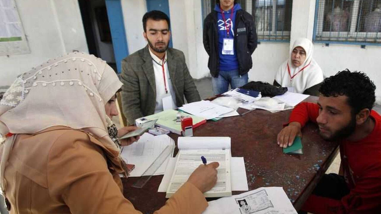 Palestinian updates his details at a centre run by the Palestinian Central Election Commission in Gaza City A Palestinian updates his details at a centre run by the Palestinian Central Election Commission (CEC), in Gaza City February 11, 2013. The Palestinian Central Election Commission on Monday began registering voters in Gaza and the West Bank for an upcoming election hoped to help with healing nearly six years of political rifts among rival factions. REUTERS/Ibraheem Abu Mustafa (GAZA - Tags: POLITICS ELECTIONS) - RTR3DMQT