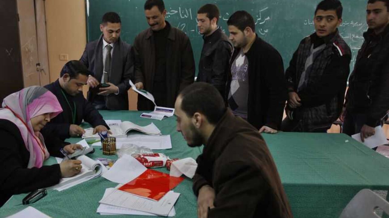 Palestinians update their details at a centre run by the Palestinian Central Election Commission in Gaza City Palestinians update their details at a centre run by the Palestinian Central Election Commission (CEC), in Gaza City February 11, 2013.The Palestinian Central Election Commission on Monday began registering voters in Gaza and the West Bank for an upcoming election hoped to help with healing nearly six years of political rifts among rival factions. REUTERS/Ibraheem Abu Mustafa (GAZA - Tags: POLITICS ELECTIONS) - RTR3DMR0