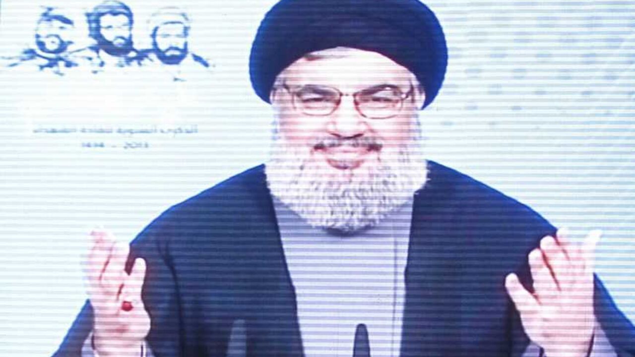 Lebanon's Hezbollah leader Sayyed Hassan Nasrallah is seen on a screen as he speaks to his supporters during a rally to commemorate Martyrs' Day in Beirut Lebanon's Hezbollah leader Sayyed Hassan Nasrallah is seen on a screen as he speaks to his supporters during a rally to commemorate Martyrs' Day in Beirut, February 16, 2013. REUTERS/Sharif Karim (LEBANON - Tags: POLITICS) - RTR3DVBX