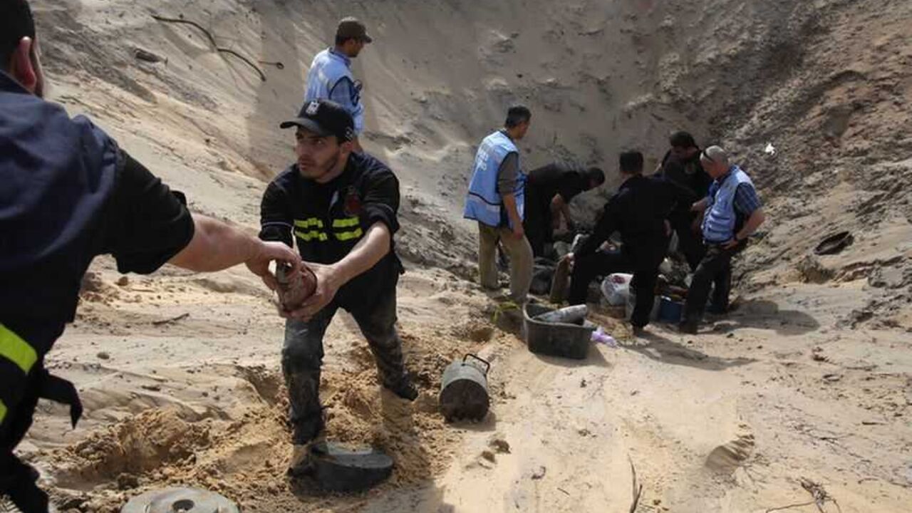 Members of the Hamas security forces and United Nations international experts prepare to destroy the remains of ordnance from an eight-day conflict between Israel and the Palestinians in 2012, in Rafah Members of the Hamas security forces and United Nations international experts prepare to destroy the remains of ordnance from an eight-day conflict between Israel and the Palestinians in 2012, in Rafah in the southern Gaza Strip February 25, 2013. REUTERS/Ibraheem Abu Mustafa (GAZA - Tags: POLITICS CONFLICT) - RTR3E9UU