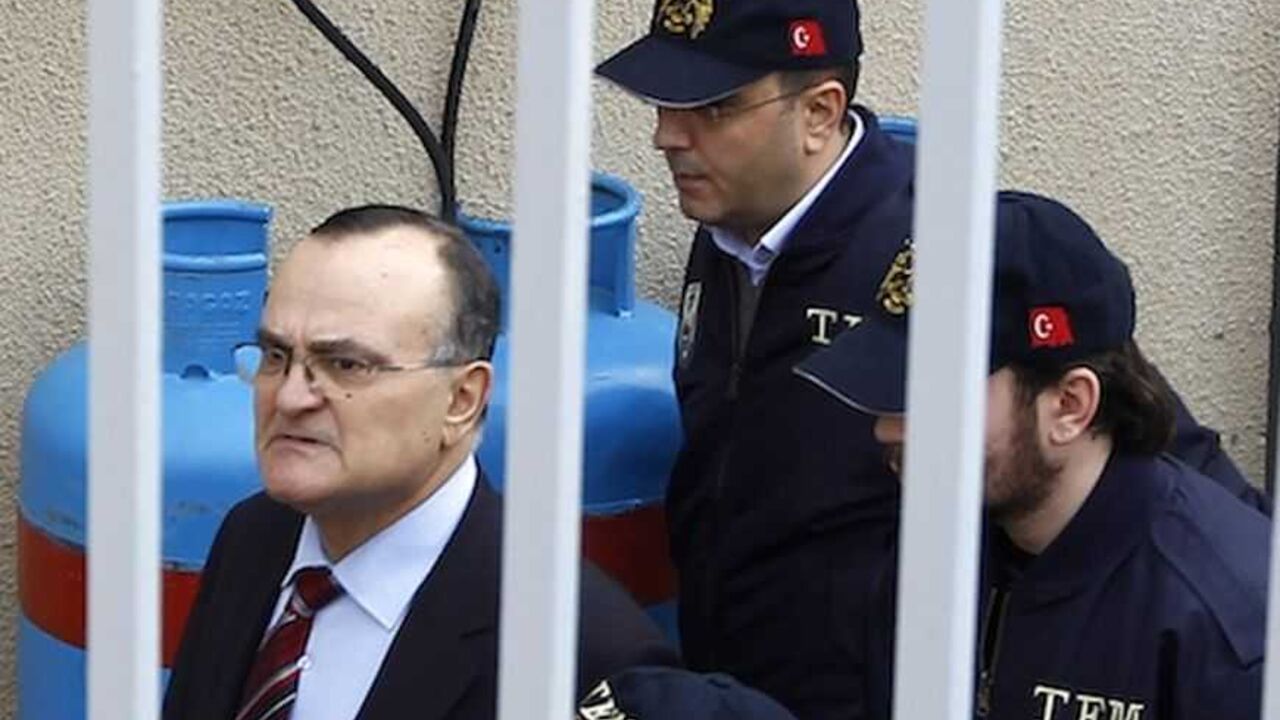 Former deputy Chief of the General Staff General Ergin Saygun is escorted by police officers at a courthouse in Istanbul Former deputy Chief of the General Staff General Ergin Saygun (L) is escorted by police officers at a courthouse in Istanbul February 25, 2010. Turkey's political and military leaders meet on Thursday as a storm gathers over a coup plot investigation against the armed forces which is threatening stability and investor confidence in the EU-candidate country. The most senior detainees, retired Air Force Commander Ibrahim Firtina and ex-navy chief Ozden Ornek, are brought to the court for questioning on Thursd
