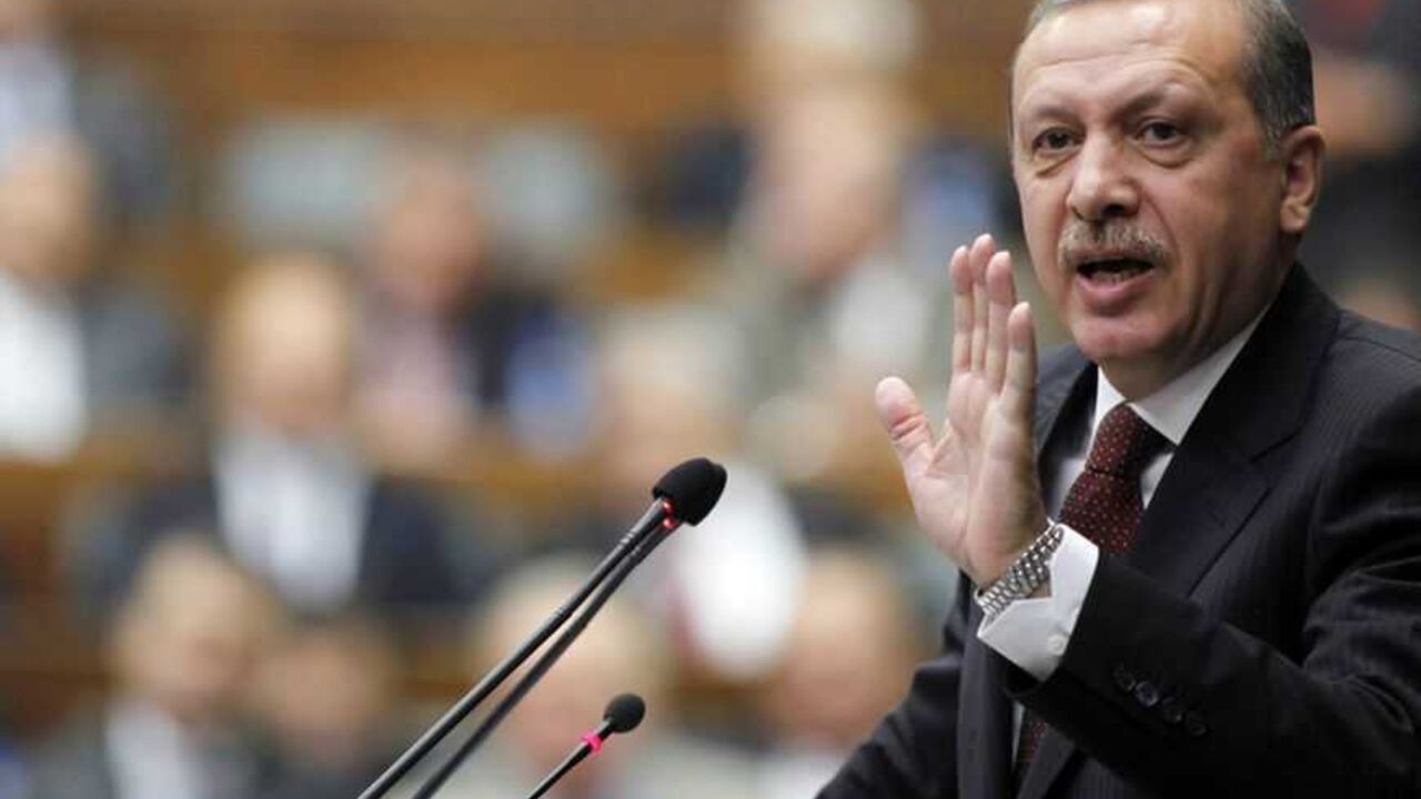 Turkey's Prime Minister Erdogan addresses members of parliament from his ruling AK Party during a meeting at the Turkish parliament in Ankara Turkey's Prime Minister Tayyip Erdogan addresses members of parliament from his ruling AK Party during a meeting at the Turkish parliament in Ankara April 19, 2010. REUTERS/Umit Bektas (TURKEY - Tags: POLITICS) - RTR2D060