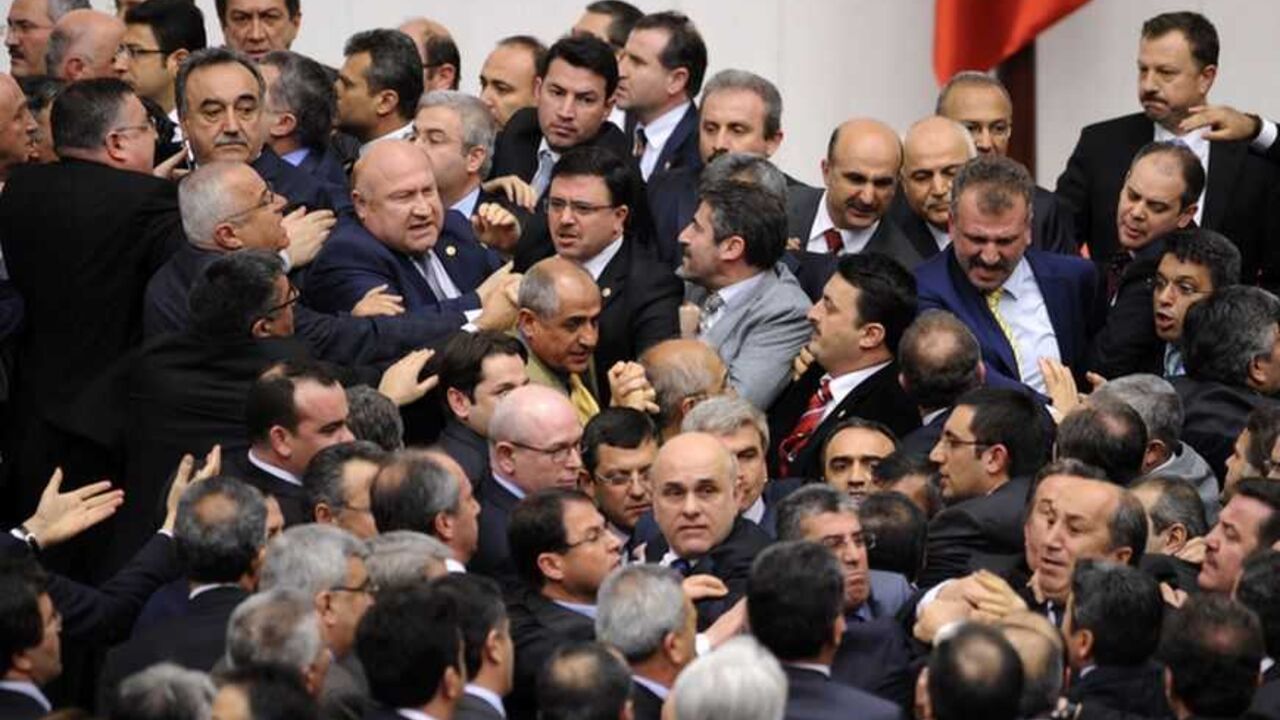 Members of Turkish parliament from the ruling AK Party and Republican People's Party scuffle during a debate at the parliament in Ankara Members of Turkish parliament from the ruling AK Party (AKP) and Republican People's Party (CHP) scuffle during a debate at the parliament in Ankara late February 8, 2012. REUTERS/Stringer (TURKEY - Tags: POLITICS CIVIL UNREST) - RTR2XIJG