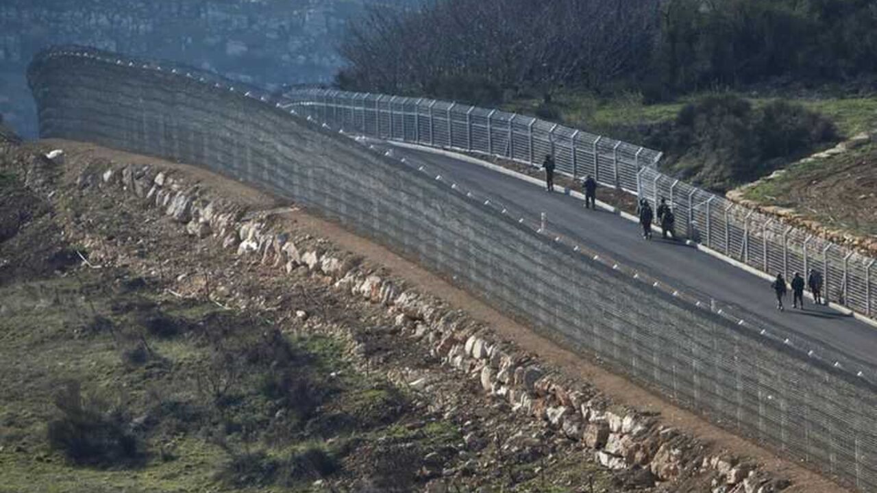 Israeli soldiers patrol in the Syrian-Israeli ceasefire line near the Druze village of Majdal Shams in the Golan Heights Israeli soldiers patrol in the Syrian-Israeli ceasefire line near the Druze village of Majdal Shams in the Golan Heights March 30, 2012. Israel deployed thousands of extra security forces nationwide on Friday, reinforcing border crossings with Lebanon and Syria and shutting crossings with the occupied West Bank after Palestinian groups announced plans to march on Israel's borders on a day when Israeli Arabs mark "Land Day", the annual commemorations in Israel of the killing by police of six Arab citizens in