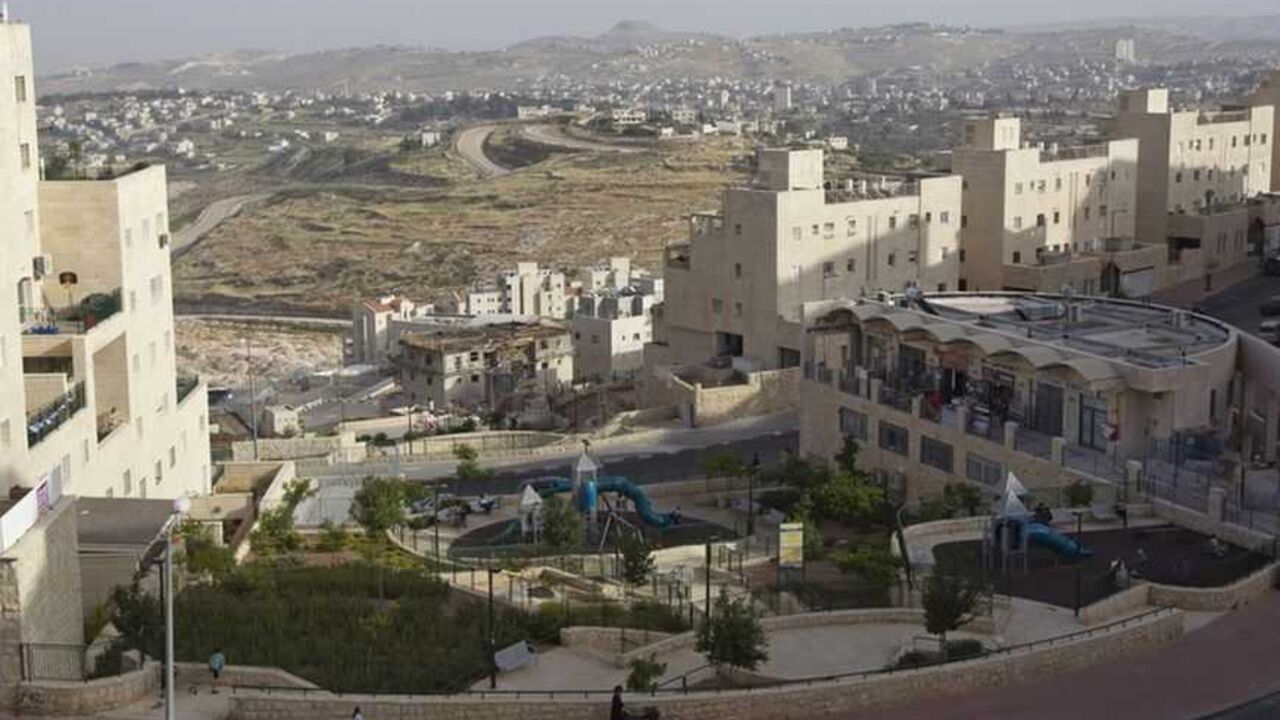 To match insight PALESTINIANS-ISRAEL/JERUSALEM A general view shows Palestinian villages (rear) around a Jewish settlement near Jerusalem known to Israelis as Har Homa and to Palestinians as Jabal Abu Ghneim April 25, 2012. Har Homa is a terraced suburb of neat, white-stone apartments housing 13,000 Israelis that overlooks the biblical town of Bethlehem. Of all the obstacles blocking the way to peace between the Palestinians and Israelis, the status of Jerusalem is arguably the most intractable. Picture taken April 25, 2012. To match insight PALESTINIAN