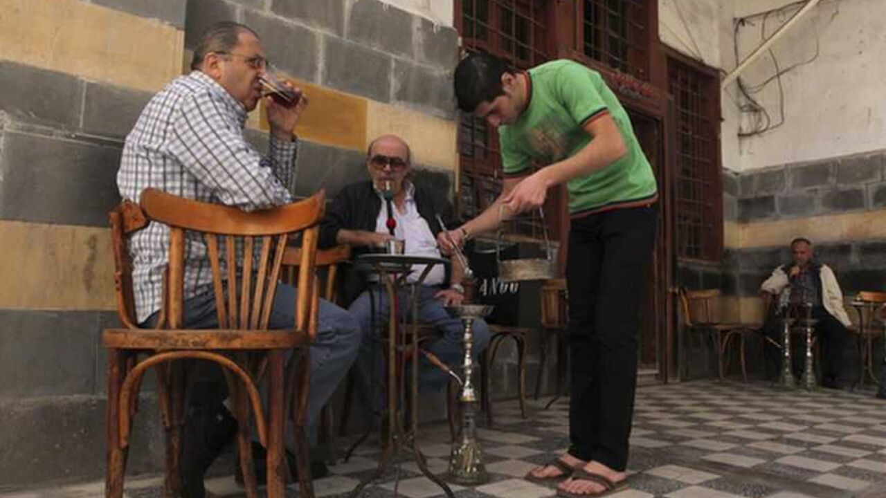 Men drink tea and smoke water pipe at a cafe in the old city of Damascus Men drink tea and smoke water pipe at a cafe in the old city of Damascus November 8, 2012. REUTERS/Muzaffar Salman (SYRIA - Tags: SOCIETY) - RTR3A600