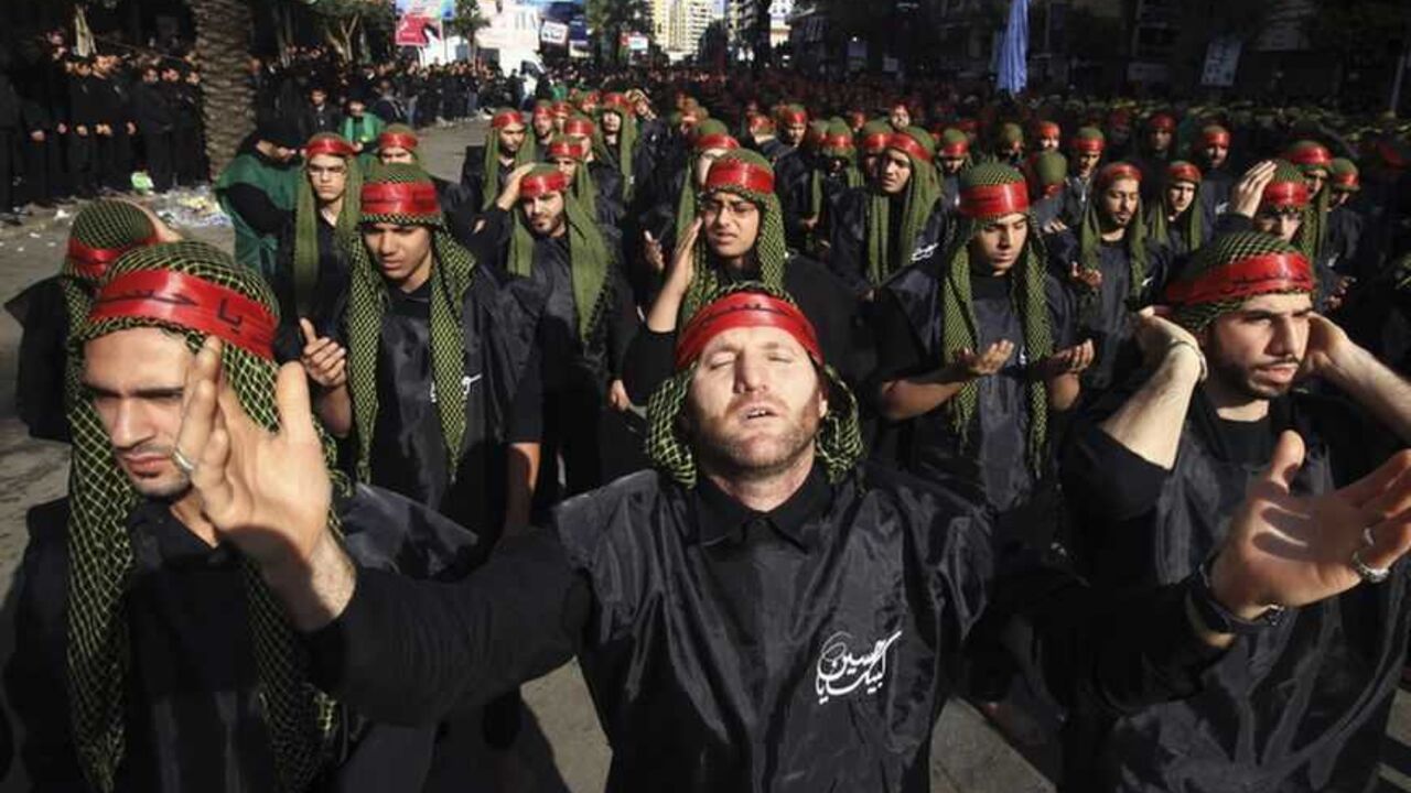 Lebanon's Hezbollah supporters gesture as they pray during a ceremony to mark Ashura in Beirut's suburbs Lebanon's Hezbollah supporters gesture as they pray during a ceremony to mark Ashura in Beirut's suburbs, November 25, 2012. Hezbollah leader Sayyed Hassan Nasrallah warned Israel on Sunday that thousands of rockets would rain down on Tel Aviv and other Israeli cities if Israel attacked Lebanon. In a speech marking the Shi'ite Muslim festival of Ashura, Nasrallah said Hezbollah's response to any attack would dwarf the attacks from Gaza during the eight-day conflict between Israel and the Islamist Hamas rule