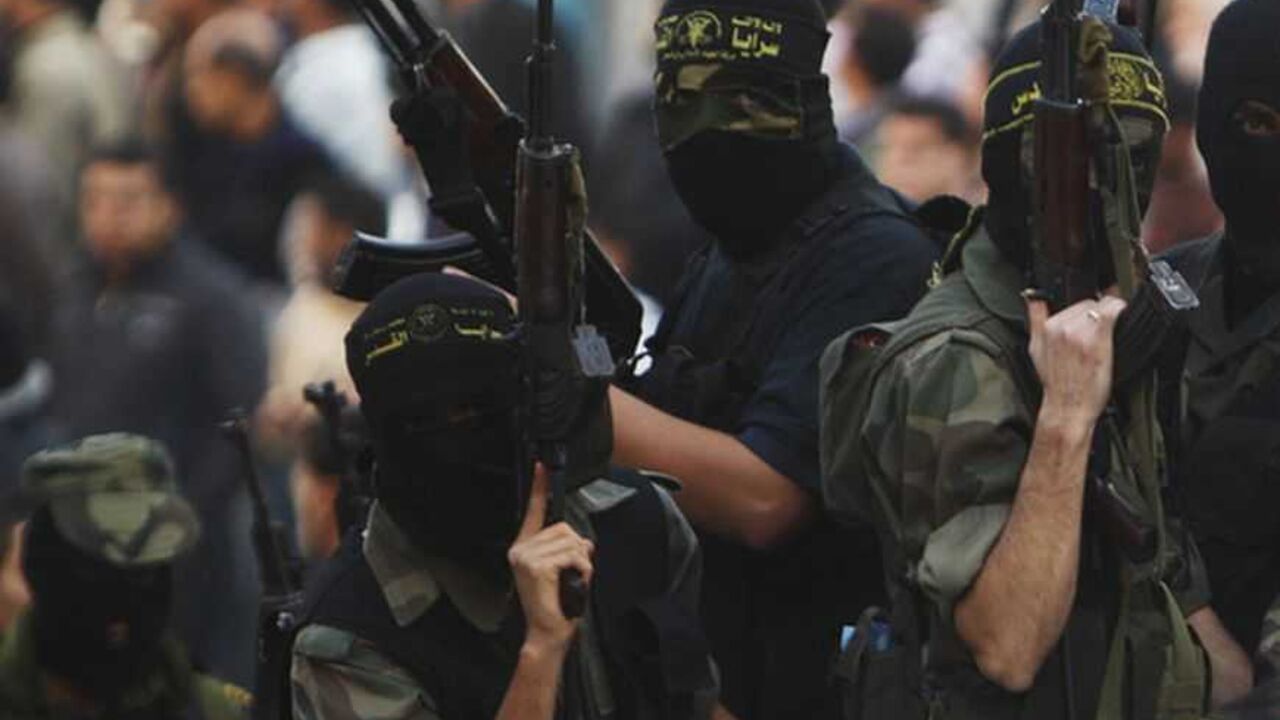 Islamic Jihad militants take part in the funeral of their comrade Mahmoud Shaath in Khan Younis, in the southern Gaza Strip Islamic Jihad militants take part in the funeral of their comrade Mahmoud Shaath in Khan Younis, in the southern Gaza Strip November 28, 2012. Shaath died on Wednesday from a wound he suffered from an Israeli air strike during an eight-day conflict, Palestinian medics said. Eight days of Israeli air strikes on Gaza and cross-border Palestinian rocket attacks ended in an Egyptian-brokered truce agreement a week ago that called on Israel to ease restrictions on the territory. REUTERS/Ibraheem Abu Mustafa (GAZ