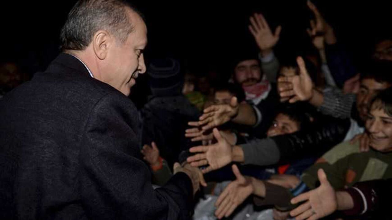 Turkish Prime Minister Tayyip Erdogan shakes hands with Syrian refugees as he visits a refugee camp near Akcakale border crossing on the Turkish-Syrian border, southern Sanliurfa province Turkish Prime Minister Tayyip Erdogan shakes hands with Syrian refugees as he visits a refugee camp near Akcakale border crossing on the Turkish-Syrian border, southern Sanliurfa province, December 30, 2012. REUTERS/Kayhan Ozer/Prime Minister's Press Office/Handout (TURKEY - Tags: POLITICS CONFLICT) FOR EDITORIAL USE ONLY. NOT FOR SALE FOR MARKETING OR ADVERTISING CAMPAIGNS. THIS IMAGE HAS BEEN SUPPLIED BY A THIRD PARTY. IT IS DISTRIBUTED, EXACTLY AS RECEIVED BY REUTERS, AS A SERVICE TO CLIENTS - RTR3BZG7