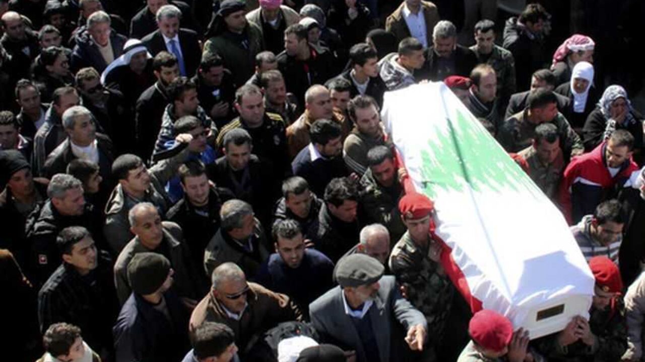 Lebanese soldiers carry the coffin of Sergeant Ibranim Zahraman during his funeral in the town of Akkar northern Lebanese soldiers carry the coffin of Sergeant Ibranim Zahraman during his funeral in the town of Akkar northern Lebanon February 2, 2013. Four Lebanese soldiers and two gunmen were killed in clashes in the country's Bekaa Valley on Friday after militants attacked a Lebanese army unit, security sources said. REUTERS/Stringer (LEBANON - Tags: CIVIL UNREST MILITARY POLITICS) - RTR3D9I8