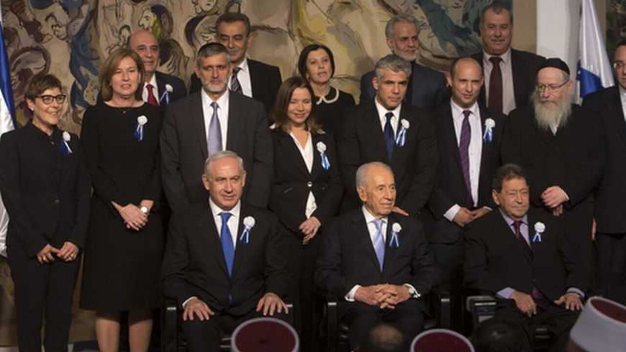 Israel's President Shimon Peres (C, seated) sits between Prime Minister Benjamin Netanyahu (L, seated) and Labour party lawmaker Binyamin Ben-Eliezer (R, seated) as party leaders of the 19th Knesset, the new Israeli parliament, pose for a group photo at a reception following their swearing-in ceremony in Jerusalem February 5, 2013. REUTERS/Ronen Zvulun (JERUSALEM - Tags: POLITICS) - RTR3DE0A