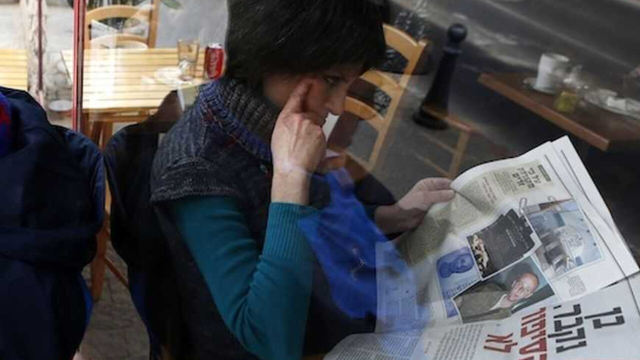 Woman is seen through a coffee shop window as she reads an article about Zygier in a newspaper in Jerusalem A woman is seen through a coffee shop window as she reads an article about Ben Zygier in an Yedioth Ahronoth newspaper in Jerusalem February 15, 2013. Zygier, the Australian immigrant reported to have been recruited by Israel's Mossad spy agency, was charged with grave crimes before he committed suicide in an Israeli jail, one of his lawyers said on Thursday. REUTERS/Baz Ratner (JERUSALEM - Tags: POLITICS CRIME LAW) - RTR3DTPG