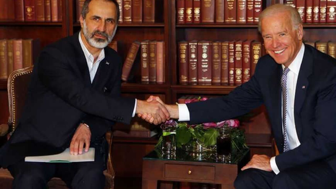 Sheikh Alkhatib and US Vice-President Biden meet at the 49th Conference on Security Policy in Munich Sheikh Moaz Alkhatib, President of the National Coalition of Syrian Revolutionary and Opposition Forces and U.S. Vice-President Joe Biden (R) meet for bilateral talks during the 49th Conference on Security Policy in Munich February 2, 2013. Senior U.S., Russian and U.N. officials, along with the leader of the Syrian opposition, were all expected in Munich on Saturday, providing a rare opportunity for talks to revive efforts to end the civil war in Syria. REUTERS/Michael Dalder(GERMANY - Tags: MILITARY