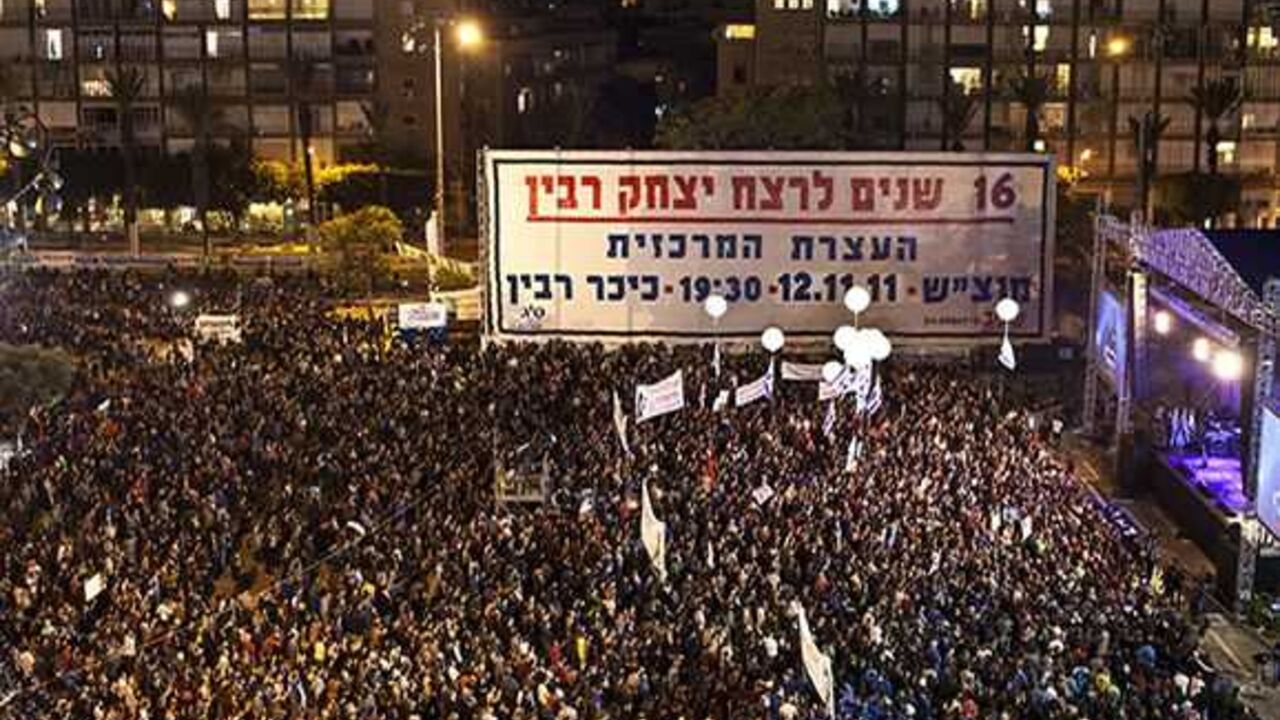 ISRAEL/ A general view shows Rabin Square during a mass rally marking the 16th anniversary of the assassination of then-Israeli prime minister Yitzhak Rabin, in Tel Aviv November 12, 2011. Israel on Saturday marked the 16th anniversary of Rabin's assassination by an ultra-nationalist Jew. The banner reads, "16 years since the assassination of Yitzhak Rabin". REUTERS/ Nir Elias (ISRAEL - Tags: ANNIVERSARY POLITICS) - RTR2TXTH