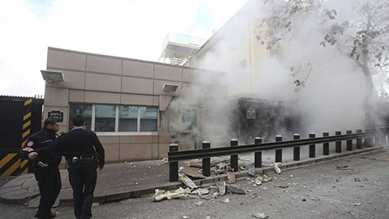 TURKEY-USA/EXPLOSION ATTENTION EDITORS - VISUAL COVERAGE OF SCENES OF INJURY OR DEATH
Turkish police officers react after an explosion at the entrance of the U.S. Embassy in Ankara February 1, 2013 in this picture provided by Milliyet Daily Newspaper. A suicide bomber killed a Turkish security guard (not pictured) at the U.S. embassy in Ankara on Friday, blowing the door off a side entrance and sending smoke and debris flying into the street. Ankara Governor Alaaddin Yuksel said the attacker was inside U.S. property when the ex
