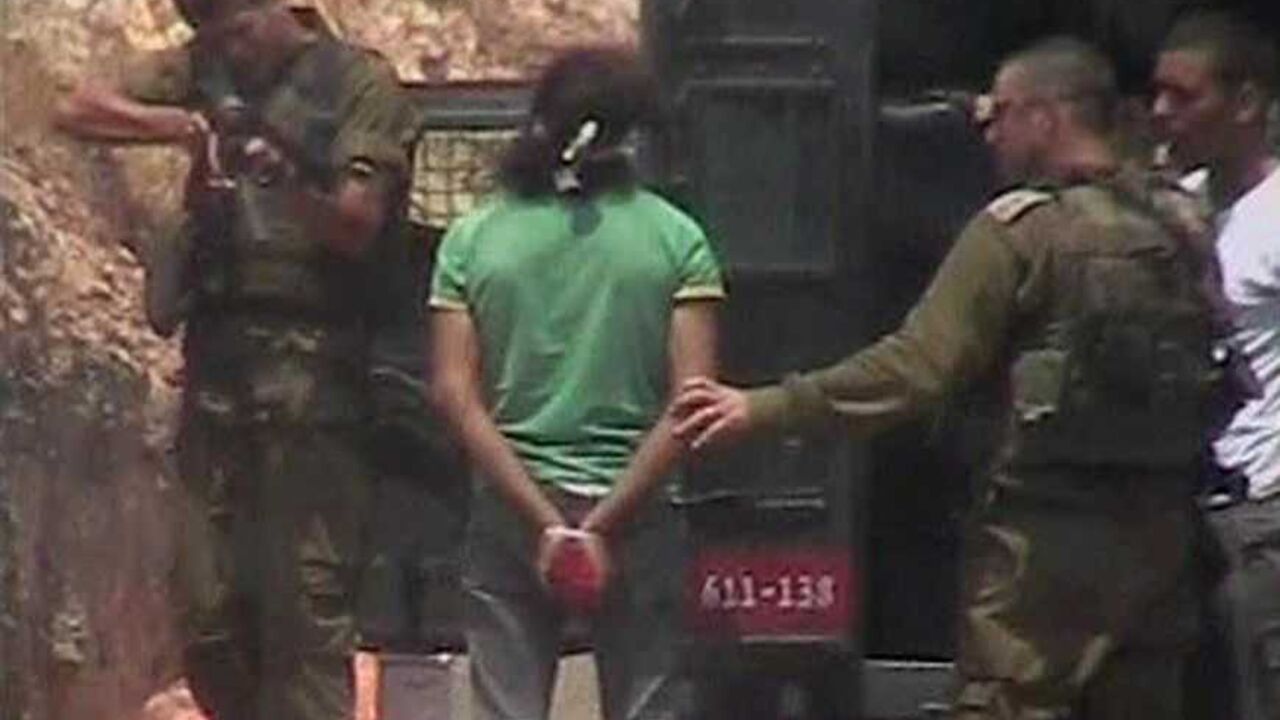 Frame grab shows an Israeli soldier firing towards the leg of a Palestinian detained during a protest against the controversial Israeli barrier in the West Bank village of Nilin An Israeli soldier fires towards the leg of a Palestinian detained during a protest against the controversial Israeli barrier in the West Bank village of Nilin, in this frame grab from a video taken about three weeks ago and released on July 20, 2008, by Israeli rights group B'Tselem. The video footage of the Israeli soldier firing what appears to be a rubber bullet at point-blank range at a bound and blindfolded Palestinian detainee has led to an army investigation. REUTERS/B'Tselem via Reuters TV (WEST