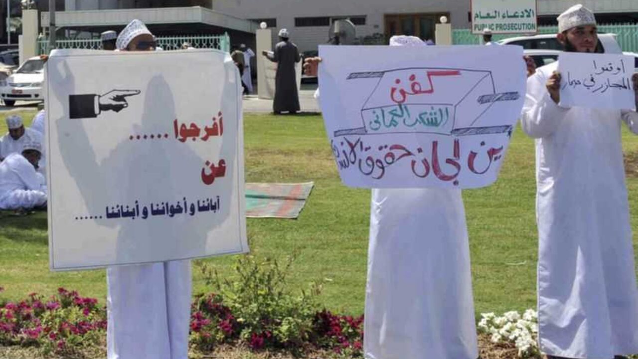 Protesters hold signs during a protest in front of the Public Prosecution building in Muscat Protesters hold signs reading "Stop killing people in Sohar" and "Release our fathers, brothers, and sons" during a protest in front of the Public Prosecution building in Muscat April 2, 2011. Protests in Oman, which pumps out 800,000 barrels of oil a day, have focused on demands for better wages, jobs and an end to corruption. Many protesters have demanded that the government be held accountable for the detention of hundreds of demonstrators in Sohar. REUTERS/Said Al Bahri (OMAN- Tags: CIVIL UNREST POLITIC