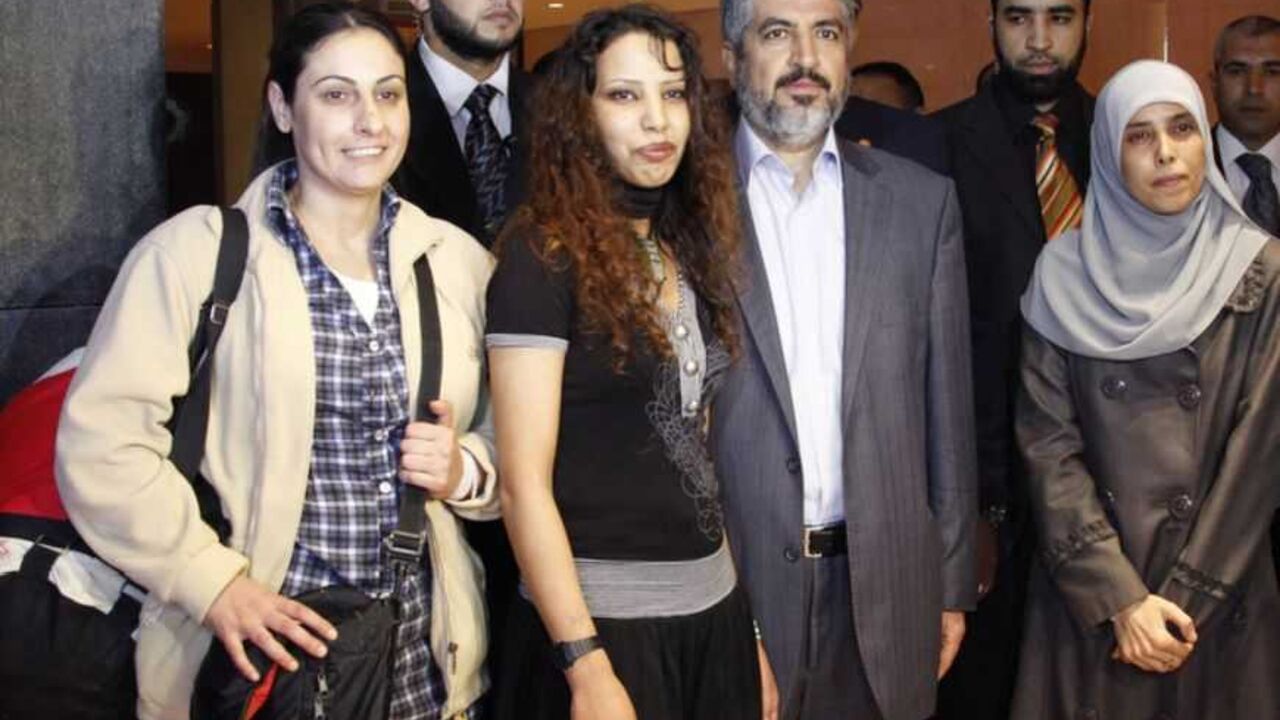 Palestinian former women prisoners pose with Hamas leader Khaled Meshaal after they were released and deported from Israeli jails and arrived in Cairo Palestinian former women prisoners pose with Hamas leader Khaled Meshaal after they were released and deported from Israeli jails and arrived in Cairo, October 18, 2011. Israeli soldier Gilad Shalit and hundreds of Palestinians crossed Israel's borders in opposite directions on Tuesday as a thousand-for-one prisoner exchange brought joy to families but did little to ease decades of conflict. REUTERS/Jamal Saidi (EGYPT - Tags: CIVIL UNREST POLITICS) - RTR2ST34