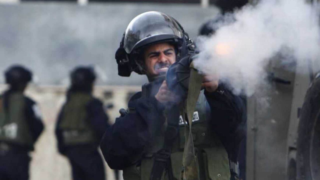 An Israeli policeman fires a tear gas canister during clashes with Palestinian protesters at a demonstration in Hebron An Israeli policeman fires a tear gas canister during clashes with Palestinian protesters at a demonstration against the closure of Shuhada street to Palestinians, in the West Bank city of Hebron February 24, 2012. Some 200 protesters, including foreign and Israeli activists, gathered on Friday marking the 18th anniversary of the closure of the street, which was closed by the Israeli army in 1994 following the Hebron mosque massacre by Baruch Goldstein, an Israeli settler, who went on a rampage inside Al Ib