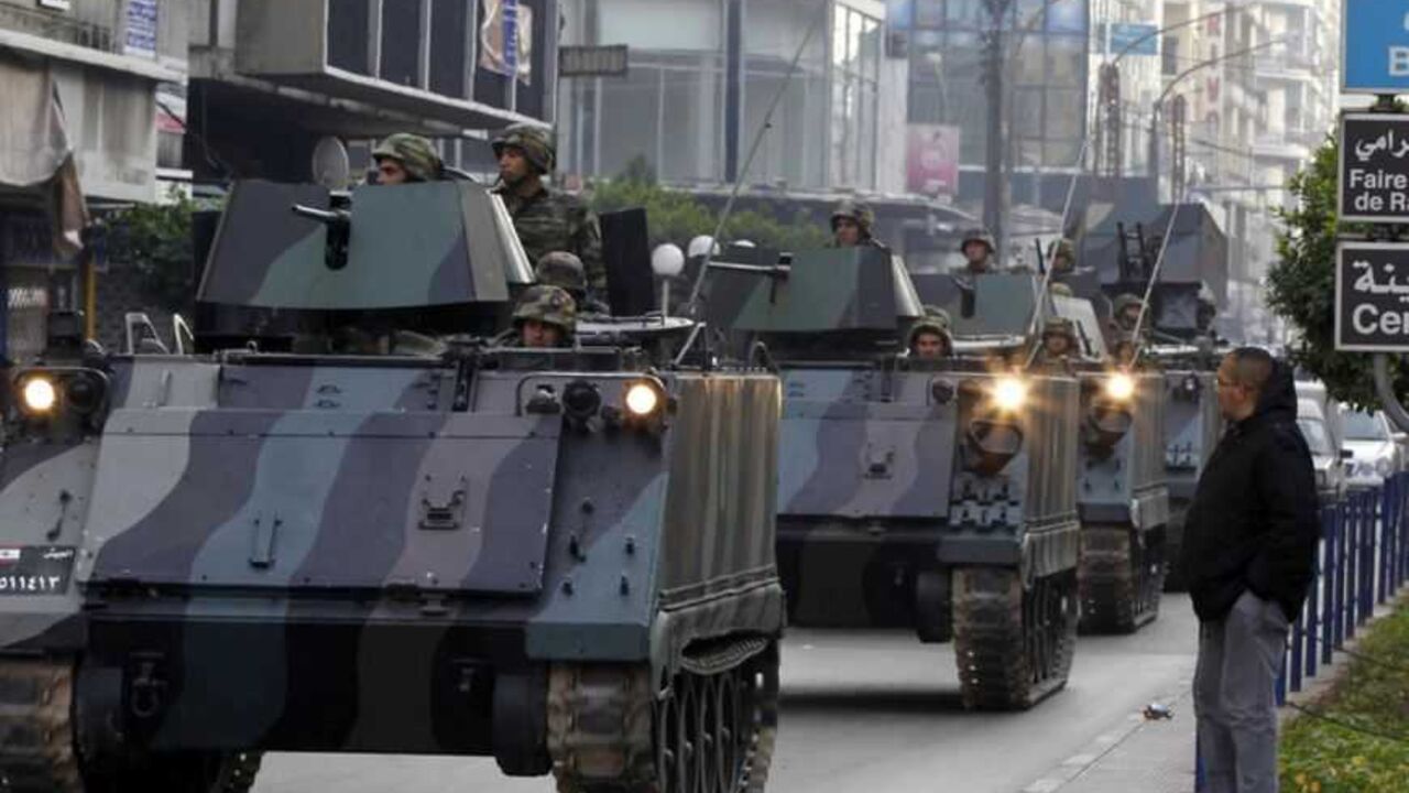 Lebanese Army soldiers deploy after gunmen ambushed the convoy of Lebanese Minister of Sports and Youth Faisal Karami in the northern city of Tripoli Lebanese Army soldiers deploy after gunmen ambushed the convoy of Lebanese Minister of Sports and Youth Faisal Karami in the northern city of Tripoli January 18, 2013. Gunmen ambushed the convoy in Tripoli on Friday, wounding three people and riddling a security patrol car with bullets, medics and witnesses said. Karami, appeared to be unhurt, the medics said. REUTERS/Mohamed Azakir (LEBANON - Tags: POLITICS CIVIL UNREST) - RTR3CLYJ