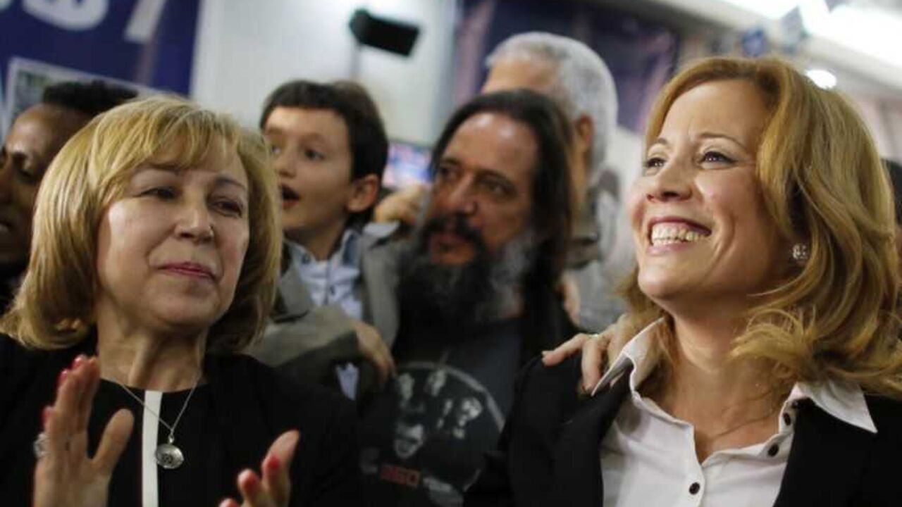 Dr. Aliza Lavie (C), a Yesh Atid (There's a future) party candidate, celebrates exit poll results at the party's headquarters in Tel Aviv January 22, 2013. Israel's parliament, long heavy with retired generals, is getting a new look, with a freshman class that includes two youth protest leaders, an Ethiopian immigrant, a high tech millionaire and more women than ever. Thanks to the surprise second place finish of Yesh Atid, as well as the success of a new far-right group, the 120-member Knesset will have a 