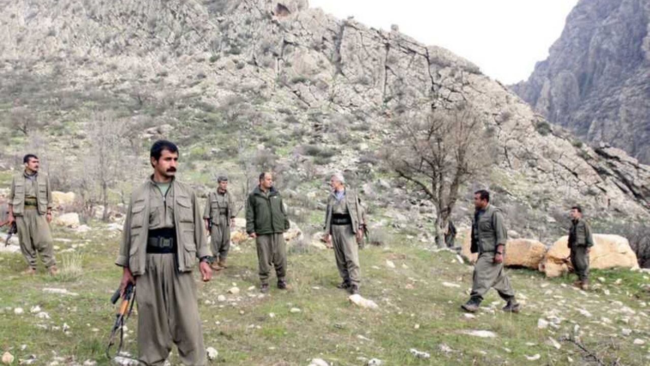 PKK fighters stand guard during the release of eight Turkish prisoners in the northern Iraqi city of Dohuk PKK fighters stand guard during the release of eight Turkish prisoners in the northern Iraqi city of Dohuk, March 13, 2013. Turkish Kurd militants freed a group of Turkish soldiers and officials they had held in the mountains of northern Iraq for more than a year on Wednesday, the first concrete step in efforts to end their 28-year-old insurgency. The six soldiers, a police officer and a local official looked in good health and wore clean clothes as they were handed to a delegation of Turkish rights activi