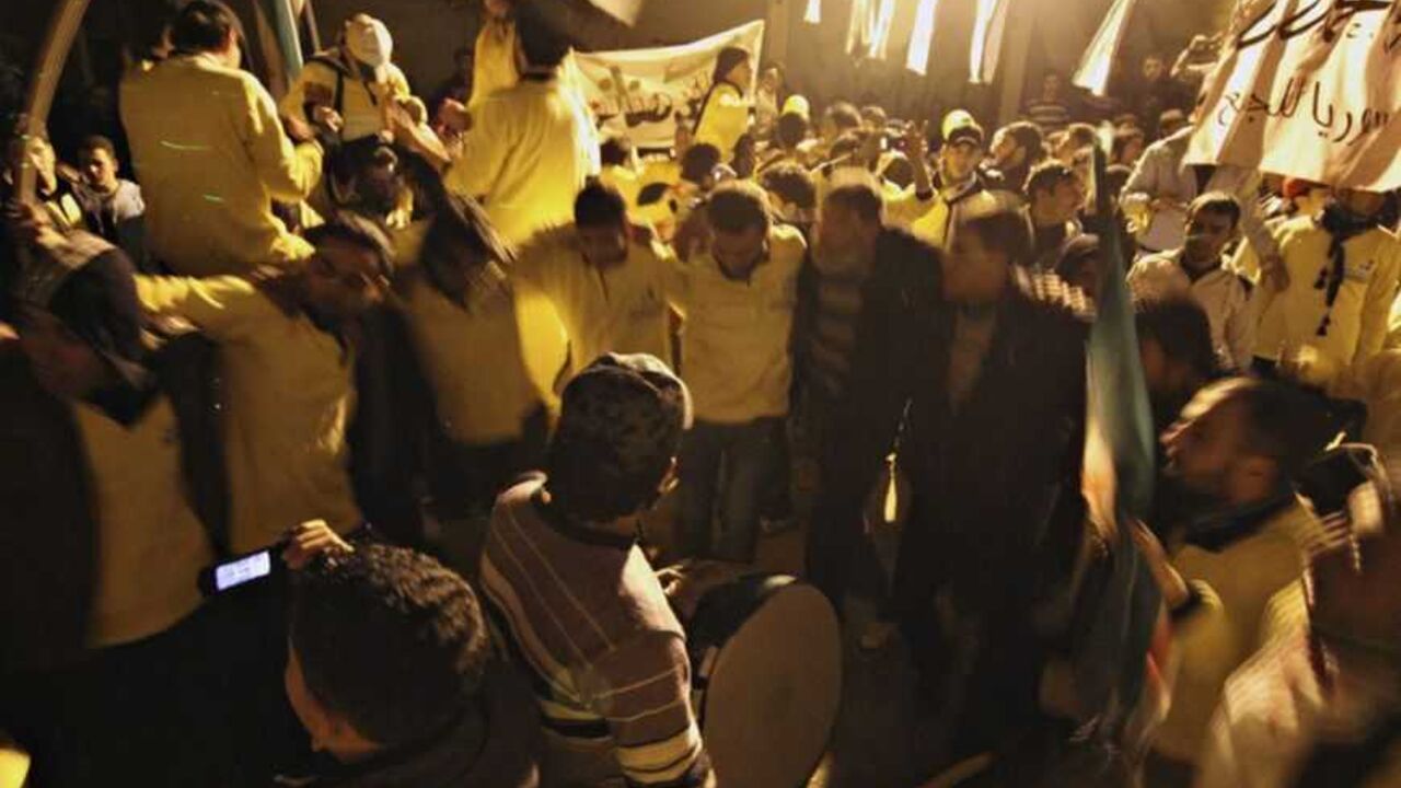 Demonstrators dance during a protest marking two years since the start of the uprising , in the Bustan al-Qasr district in Aleppo Demonstrators dance during a protest marking two years since the start of the uprising , in the Bustan al-Qasr district in Aleppo March 17, 2013. REUTERS/Giath Taha (SYRIA - Tags: ANNIVERSARY POLITICS CIVIL UNREST) - RTR3F4RR