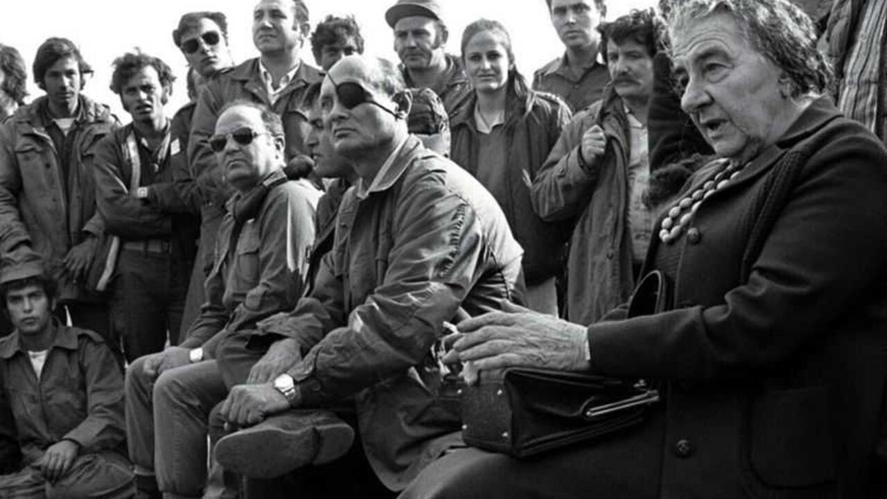 - FILE PHOTO 21NOV73 - Prime Minister Golda Meir (R) accompanied by her Defense Minister Moshe Dayan.. - FILE PHOTO 21NOV73 - Prime Minister Golda Meir (R) accompanied by her Defense Minister Moshe Dayan, meets with Israeli soldiers at a base on the Golan Heights after intense fighting during the 1973 Yom Kippur War.[ Israel was simultaneously attacked by Syria and Egypt on Yom Kippur, the Jewish Day of Atonement when all of Israel comes to a standstill, and was only able to defeat both countries when the United States provided an emergency major resupply of equipment. Israel suffered heavy causalities and m