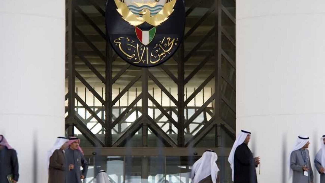Kuwaiti men stand at the main entrance of the Kuwait Parliament Kuwaiti men stand at the main entrance of the Kuwait Parliament December 10, 2009, after the parliament session on the issue of "bedoons" (stateless Kuwaiti residents) was cancelled due to the lack of quorum. Police had cordoned off the area surrounding the Parliament to prevent any possible protests from the stateless people in the city. REUTERS/Stephanie McGehee (KUWAIT POLITICS) - RTXROPH