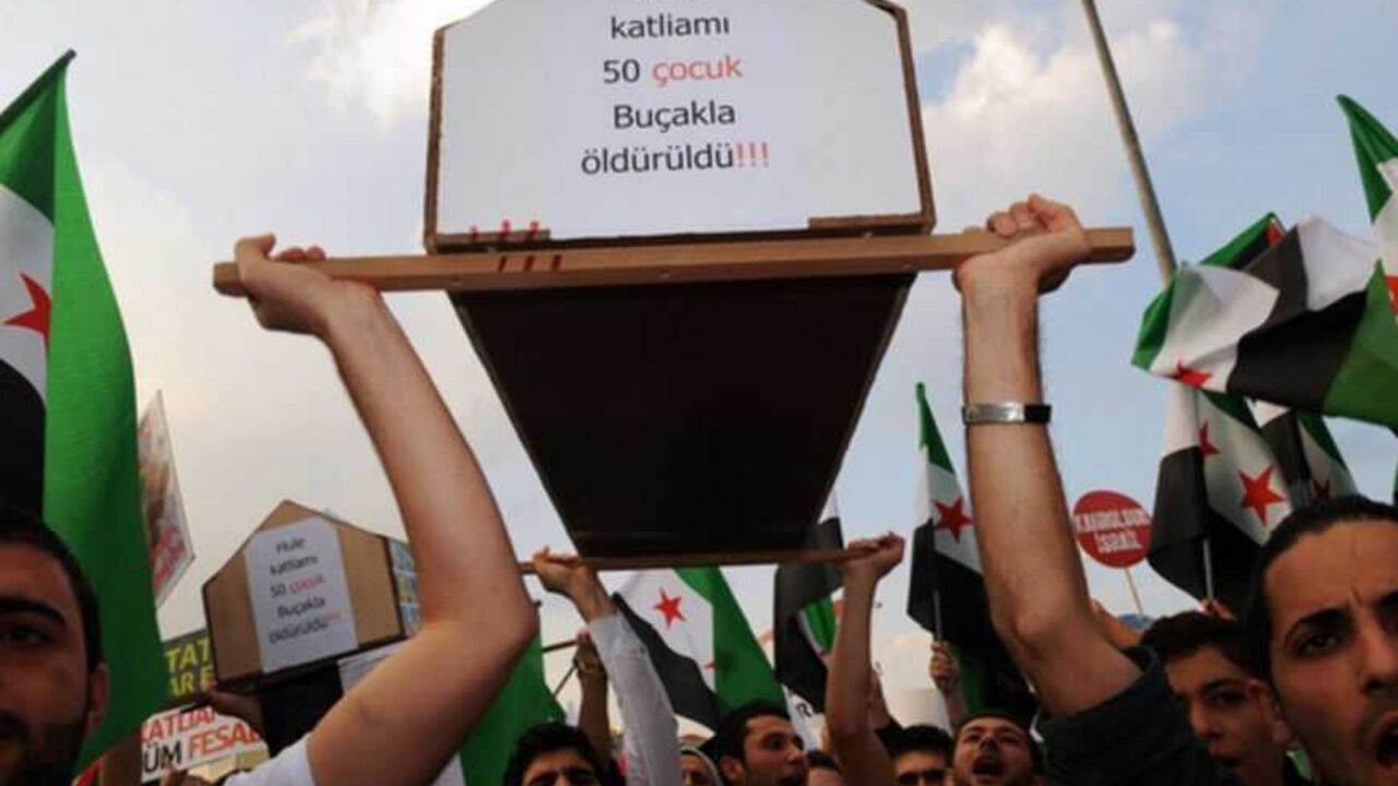 Protestors chant slogans against Israel Protestors chant slogans against Israel and Syrian President Bashar al-Assad as they carry a mock coffinwith the mention "In Hule masacre 50 children killed by knives" during a rally on May 31, 2012 on Taksim Square in Istanbul, marking the first anniversary of the death of nine Turks, shot in May 2010 when Israeli naval commandos seized the Turkish ship Mavi Marmara that was part of a flotilla trying to break the Gaza blockade. The crowd gathered in iconic Taksim Square under the banner of the pro-Islamic